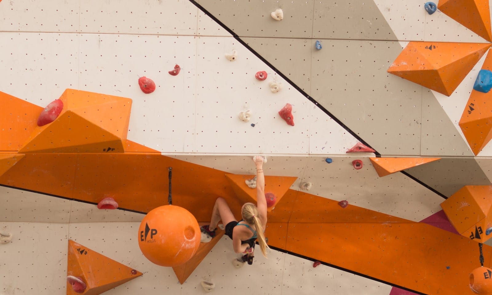 women-climbing-wall